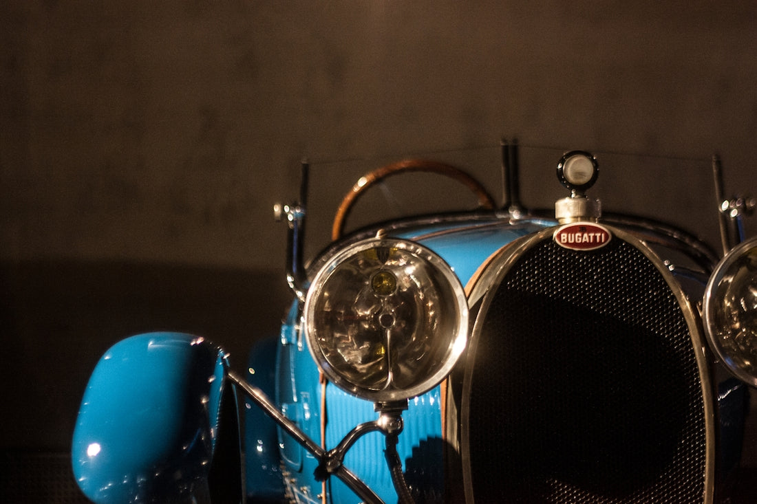 a close up of a blue car with headlights