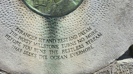 A close up of a stone with writing on it