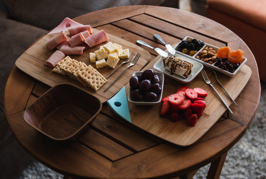 A wooden table topped with lots of food