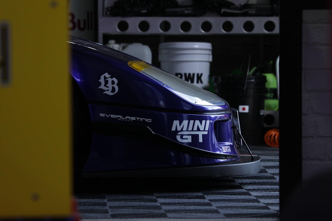 Close-up of a blue and white race car front