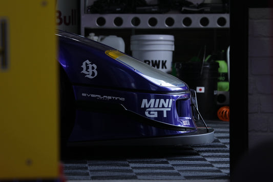 Close-up of a blue and white race car front