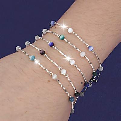 Sterling Silver Bracelets inter mixed with white and assorted colors Cat's Eye beads